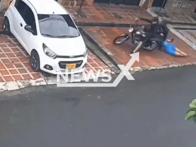 A woman beats thieves in Medellin, Colombia, undated. SHe managed to prevent being robbed. Note: Photo is a screenshot from a video. (Newsflash/NX)