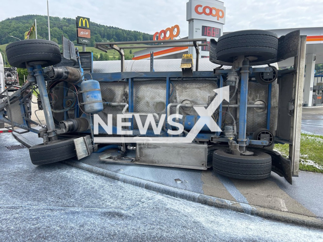 Picture shows the overturned trailer in Reinach, Switzerland, May 8, 2025. Approximately 5,000 liters of milk were spilled. Note: Licensed photo. (Kapo AG/Newsflash/NX)