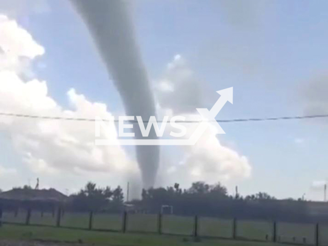 This image is a screen grab of the video supplied titled NewsX-TornadoOrenburg-01.mp4: Footage shows a powerful tornado hitting the Tobolsky settlement in Svetlinsky District of Orenburg Oblast, Russia on Thursday, May 8, 2025.(Clipzilla/NX)