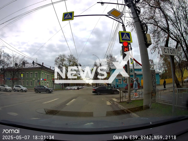 This image is a screen grab of the video supplied titled NewsX-BikerIntersection-01.mp4: Dashcam shows a 23-year-old female biker failing to give way and colliding with a car at an intersection in Vologda, Russia on Wednesday, May 7, 2025.(Clipzilla/NX)