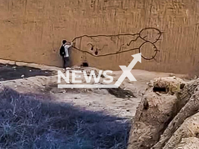 Young man paints penis on Chan Chan wall in Trujillo, Peru, undated. The investigation has reportedly started. Note: Private photo taken from local media. (Newsflash/NX)