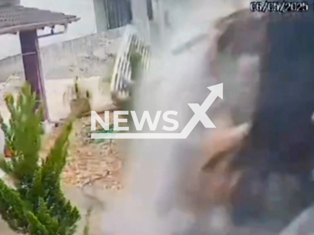This image is a screen grab of the video supplied titled NewsX-GetHos-01.mp4: A truck loaded with rubble destroys the house wall in Itajai, Santa Catarina, Brazil on Tuesday, May 6, 2025.(Clipzilla/NX)