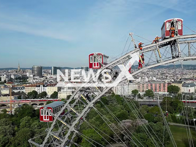 High-altitude rescuers perform an exercise, undated. Firefighters abseiled from the Vienna Giant Ferris Wheel as part of the exercise in Vienna, Austria, on May 14, 2025. Note: Firefighters photo taken from local media. (Stadt Wien/Feuerwehr/Newsflash/NX)