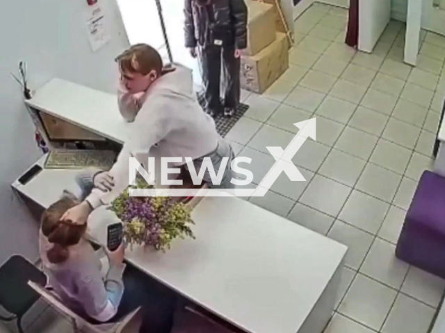 This image is a screen grab of the video supplied titled NewsX-AttackedEmployee-01.mp4: A girl attacked an employee for asking her not to smoke an electronic cigarette indoors in Omsk, Russia on Sunday, May 11, 2025.(Clipzilla/NX)