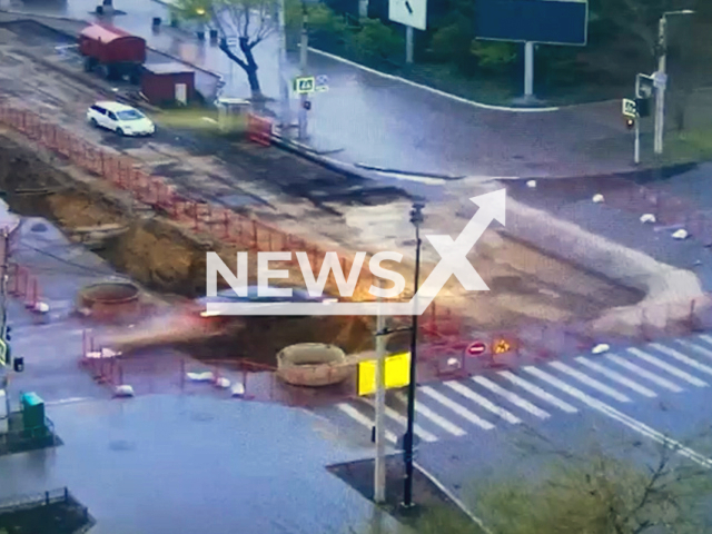 This image is a screen grab of the video supplied titled NewsX-OverPit-01.mp4: CCTV shows a drunk driver attempting a wild escape from Russian traffic police, launching his car over a roadside pit in Blagoveshchensk, Amur Oblast, Russia on Wednesday, May 14, 2025.(Clipzilla/NX)