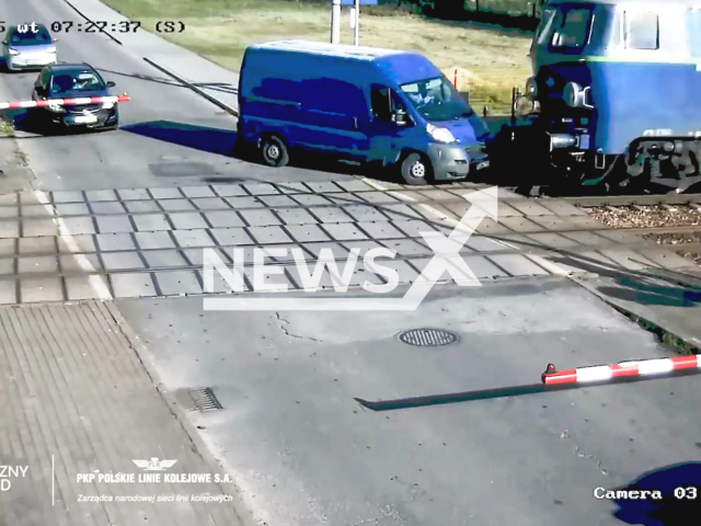 This image is a screen grab of the video supplied titled NewsX-PolsTreins.mp4: CCTV shows a van being crashed by a train at a rail crossing in Przylek Duzy, Poland on Tuesday, May 13, 2025.(Clipzilla/NX)