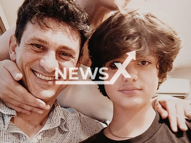 Andrea and Mattia Ahmet Minguzzi pose in undated photo. The 15-year-old son of Italian chef Andrea Minguzzi was stabbed in Kadıkoy, Istanbul, Turkey. Note: Private photo taken from local media. (Newsflash/NX)