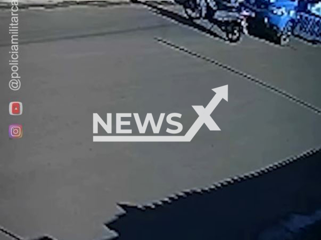 Police officers rescue a grandmother and a child during a pitbull attack in Caiaponia, Brazil, on May 08, 2025. The woman was injured. Note: Photo is a screenshot from a video(@policiamilitarcaiaponia/Newsflash/NX)