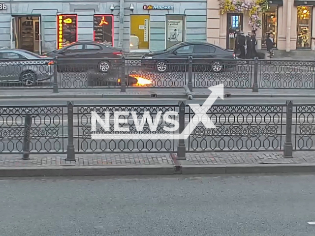 This image is a screen grab of the video supplied titled NewsX- 	
BikerCrash 01.mp4: A biker loses control and hits a car at Ligovsky Prospect, Saint Petersburg, Russia on Saturday, May 24, 2025. (Clipzilla/NX)
