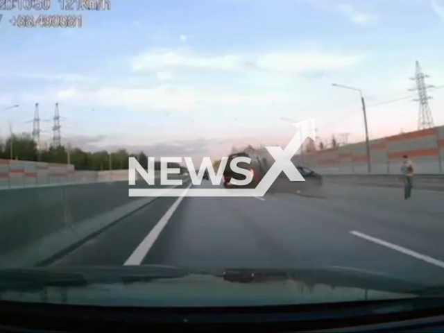 This image is a screen grab of the video supplied titled NewsX-CrashMinibus-01.mp4: Dashcam footage shows a Mercedes-Benz Sprinter 2 minibus colliding with a Lada Largus and an Audi on the M-12 highway in the Moscow region, Russia on Friday, May 23, 2025. A 50-year-old woman and a child in the Lada died.(Clipzilla/NX)