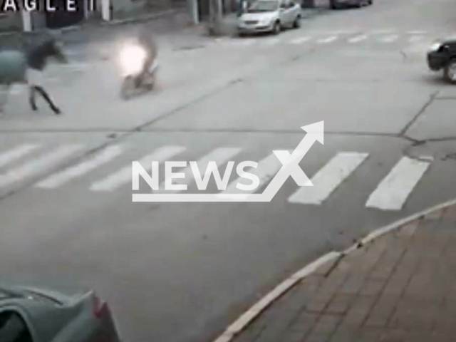A horse runs over a biker in Necochea, Buenos Aires, Argentina, undated. The biker was injured. Note: Photo is a screenshot from a video. (Newsflash/NX)