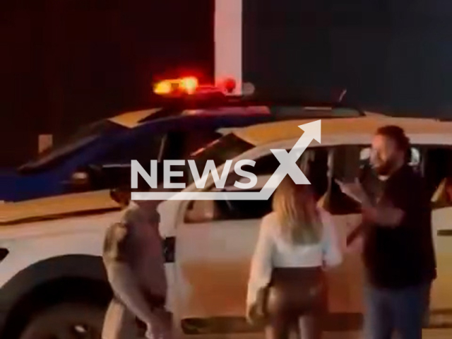 A police officer knocks out a man in Goiania, Goias, Brazil, on May 23, 2025. The man was disturbing traffic in the area. Note: Photo is a screenshot from a video. (Newsflash/NX)