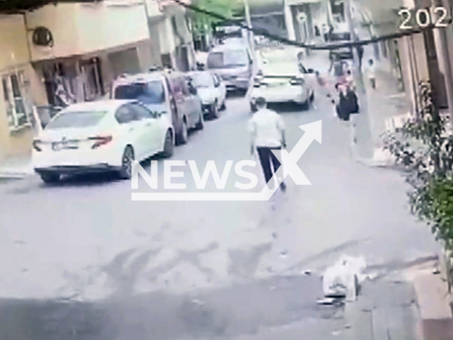 This image is a screen grab of the video supplied titled NewsX-ThreeHit-01.mp4: CCTV shows a car hitting a 3-year-old child playing on the street in Istanbul, Turkey, on Friday, May 16, 2025.(Clipzilla/NX)