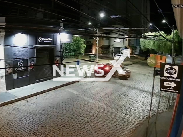 This image is a screen grab of the video supplied titled NewsX-RemsDriver-01.mp4: CCTV shows a car splitting in half after a crash, and the driver keeps going despite the damage at an intersection in Cambuí, Campinas, Sao Paulo, Brazil on Friday, May 16, 2025.
