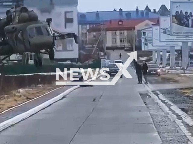 This image is a screen grab of the video supplied titled NewsX-HelicopterDrop-01.mp4: Footage shows a combat helicopter dropping people on the road in Yamalo-Nenets Autonomous Okrug, Russia, undated. Footage shared on Vkontakte and linked with the evacuation of people from the potential fall zone of the Soyuz-2 rocket on May 23, 2025.(Clipzilla/NX)