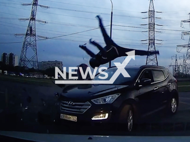 This image is a screen grab of the video supplied titled NewsX-BikerCrashAir-01.mp4: The biker is thrown into the air after a collision with a car at Dmitrievsky Street, Moscow, Russia on  Monday, May 26, 2025.(Clipzilla/NX)