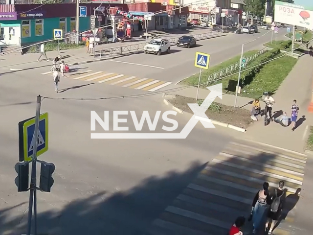 This image is a screen grab of the video supplied titled NewsX-ScooterRider-01.mp4: CCTV footage shows a scooter rider hitting two pedestrians and abandoning his friend while fleeing the scene in Uzlovaya, Tula Oblast, Russia on Wednesday, May 28, 2025.(Clipzilla/NX)