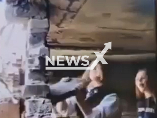 This image is a screen grab of the video supplied titled NewsX-AbandonedSite-01.mp4: Footage shows a concrete slab collapsing on schoolgirls while they were playing at an abandoned site in Terpilitsy, Leningrad Oblast, Russia on Saturday, May 31, 2025. (Clipzilla/NX)