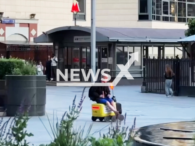 This image is a screen grab of the video supplied titled NewsX-DeliveryBot-01.mp4: A man infamously tried to ride a robot courier in Moscow, Russia, undated. Video shared on VKontakte on  Monday, June 2, 2025.(Clipzilla/NX)