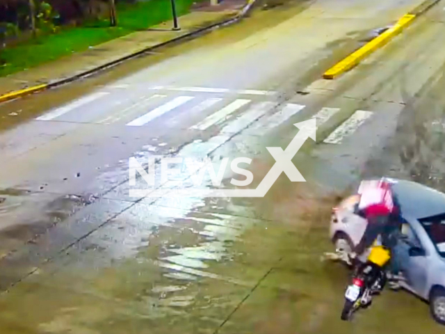 This image is a screen grab of the video supplied titled NewsX-LendBike-01.mp4: Footage shows a food delivery driver on a motorcycle flipping over the car that he had collided with in Benavidez, in the northern area of ​​the Buenos Aires metropolitan area, Argentina, undated. The Undersecretariat of Citizen Protection Tigre Operations Center released the video on Saturday, May 31, 2025.(@alertatigre/Clipzilla/NX)