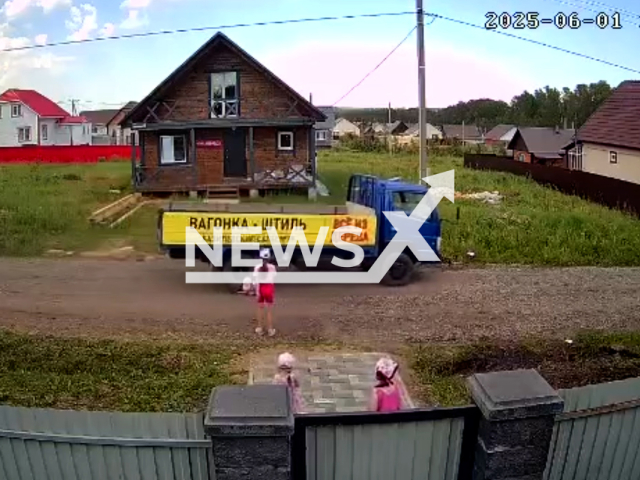 This image is a screen grab of the video supplied titled NewsX-GirlPlay-01.mp4: CCTV shows a 6-year-old girl run over by a truck while playing with her friends in Iglino, Bashkortostan, Russia on Sunday, June 1, 2025.(Clipzilla/NX)