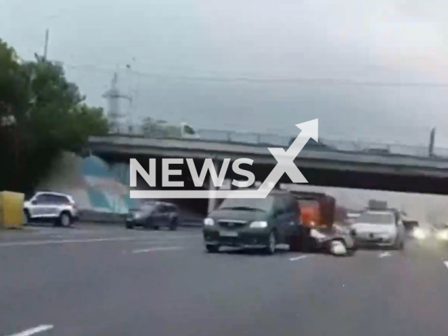 This image is a screen grab of the video supplied titled NewsX-PolicemanCrash-01.mp4: Footage shows a police officer crashing in a vehicle during a bike pursuit on Moscow Ring Road, Russia on 30 May, 2025.(Clipzilla/NX)