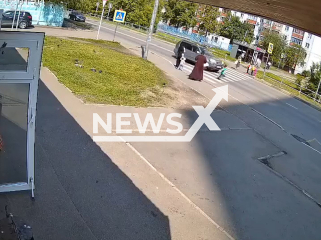 This image is a screen grab of the video supplied titled NewsX-ChildCros.mp4: CCTV shows a child hit by a car while trying to cross at a zebra crossing in Korolyov, Moscow Oblast, Russia on Monday, June 2, 2025.(Clipzilla/NX)