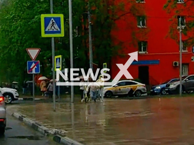 This image is a screen grab of the video supplied titled 	
ScooterStrik 01.mp4: Footage shows 2 girls on a scooter hitting a woman and fleeing the scene in Dolgoprudny, Moscow Region, Russia on Tuesday, May 13, 2025.(CZ/newsX)