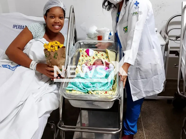 Picture shows the mother, Iria Nilza Soares Nascimento and her daughter, Vitoria, with one of the doctors, undated. She gave birth in Salvador, Bahia in Brazil, June 9, 2025. Note: Hospital photo. (INTS/Newsflash/NX)