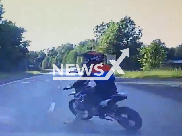 This image is a screen grab of the video supplied titled NewsX-DirtBikeCrash-01.mp4: Footage shows a 13-year-old girl on a dirt bike not giving way to a Subaru Forester and colliding with it on the road in Mezhdurechensk, Kemerovo Oblast, Russia on Saturday, June 21, 2025.(Clipzilla/NX)