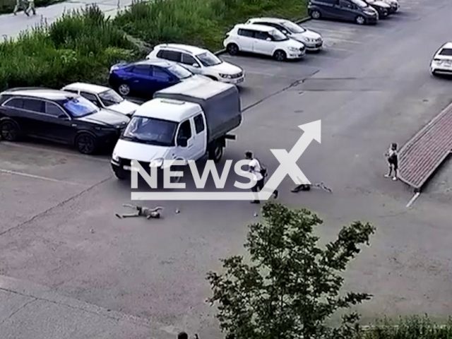 This image is a screen grab of the video supplied titled NewsX-UnlicensedDriver-01.mp4: CCTV footage shows a Gazelle hitting a child running to his father in the village of Zonalnaya Stantsiya in the Tomsk region, Russia on Monday, June 23, 2025. (Clipzilla/NX)