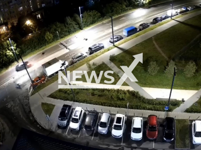 This image is a screen grab of the video supplied titled NewsX-NightRacing-01.mp4: A car driver fatally hits a motorcyclist while driving around a speed bump in the oncoming lane in the Moscow region, Russia on Thursday, June 26, 2025.(Clipzilla/NX)