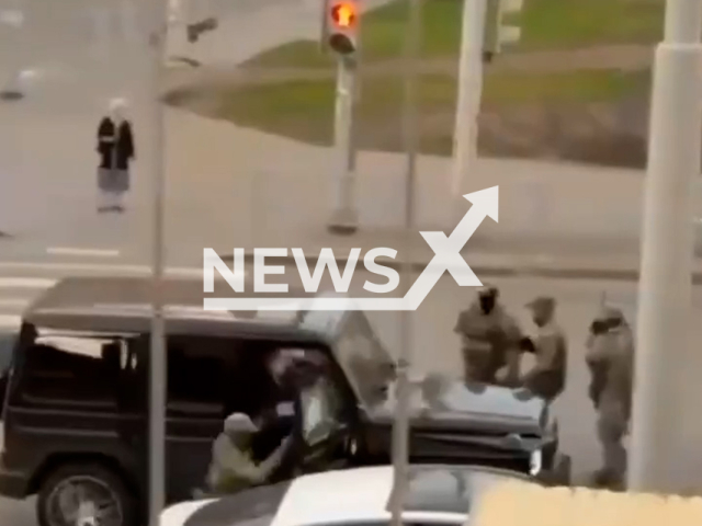 This image is a screen grab of the video supplied titled NewsX-ShahinShikhlinsky-01.mp4: Footage shows an FSB officer being struck by the open door of a Mercedes-Benz G-Class driven by Mutvala Shikhlinsky as he attempted to flee from law enforcement in Yekaterinburg, Russia, on Tuesday, July 1, 2025.(Clipzilla/NX)
