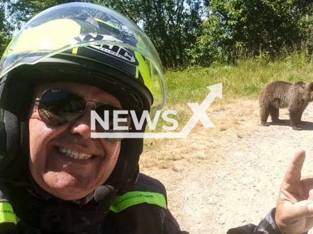 Picture shows Omar Farang Zin in a selfie with the bear, undated. The 48-year-old tourist from Lombardy was killed by a bear while he was traveling in Romania. Note: Private photo taken from social media. (Newsflash/NX)