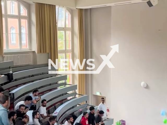 Picture shows a group of men at an event at Charite, in Berlin, Germany. The university hospital is reported to be taking action against the Muslim student group "Medislam Collective.Note: Image is a screenshot from video. (@msc_berlin/Newsflash/NX)