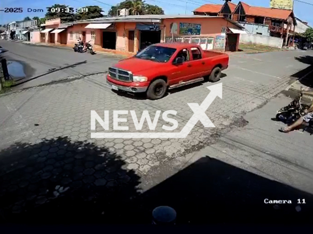 Vehicle runs over a biker in La Blanca, Guatemala, undated. The biker, Alvaro Jose Cardona Ramirez, 27, suffered only minor injuries. Note: Photo is a screenshot from a video. (Newsflash/NX)