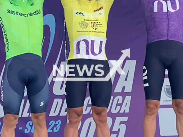 Picture shows the first-place-winner cyclist Javier Jamaica (in the middle) with the second and the third winners at the Vuelta al Valle race, undated. Jamaica crashed into a photographer. Note: Image is a screenshot from video. (Newsflash/NX)