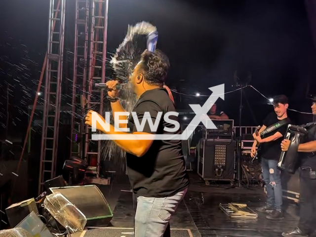 Singer is hit in the face with a beer can during a show in the municipality of Luciara, Brazil, July 19, 2025. He suffered a facial injury. Note: Photo is a screenshot from a video. (@malla100alca/Newsflash/NX)