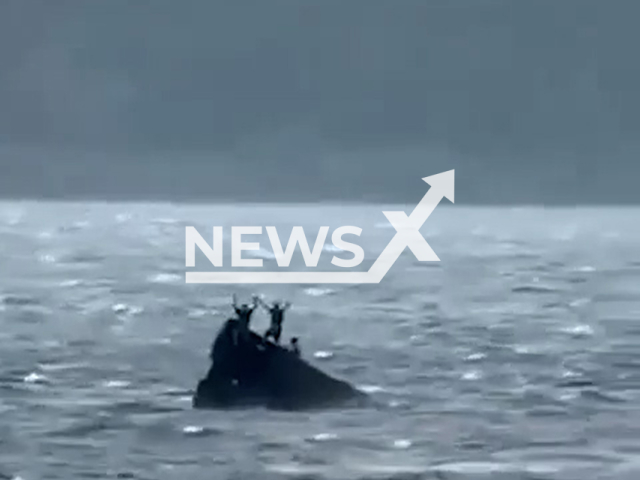 This image is a screen grab of the video supplied titled NewsX-BoatOverturn-01.mp4: Footage shows a screw tugboat with six people on board capsizing and sinking in the Volga River in the Krasnoglinsky District of Samara, Russia, on Saturday, July 12, 2025.(Clipzilla/NX)