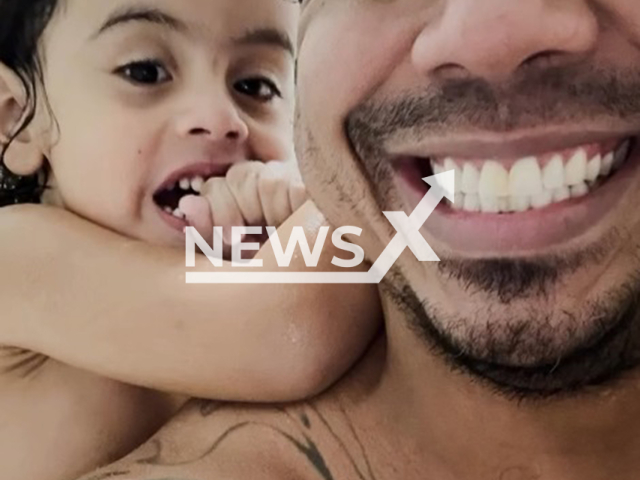 Fanho RP poses with daughter in undated photo. The girl managed to climb over the pool's safety railing and drowned in Sao Paulo, Brazil. Note: Private photo taken from social media. (@fanhorp/Newsflash/NX)