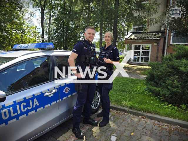 Sergeant Dawid Furman (left) and Senior Constable Patrycja Wolny (right) posing in undated photo. They rescue a 6-year-old child playing on a railway tracks moments before a train passes in Mikolow, Poland on July 26th, 2025.
Note: Police photo.
(Mikolow County Police/Clipzilla/NX)