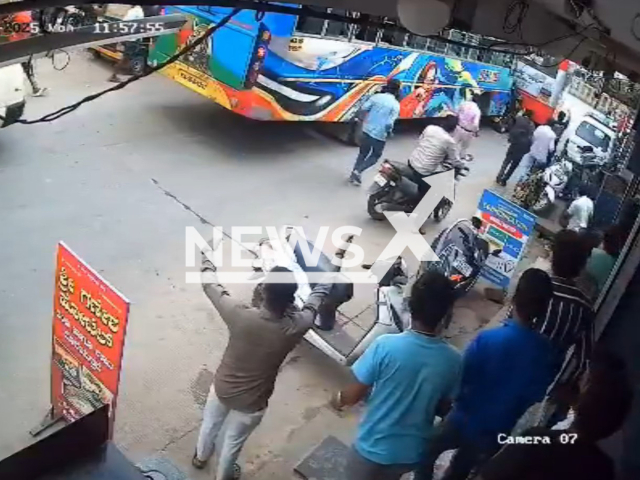 This image is a screen grab of the video supplied titled NewsX-AutoSandwiched-01.mp4: CCTV footage shows a high-speed bus ramming into an auto rickshaw from behind, crushing it between two buses, all passengers survived with injuries in Chitradurga, Karnataka, India, on Monday, Aug 4, 2025.(Clipzilla/NX)