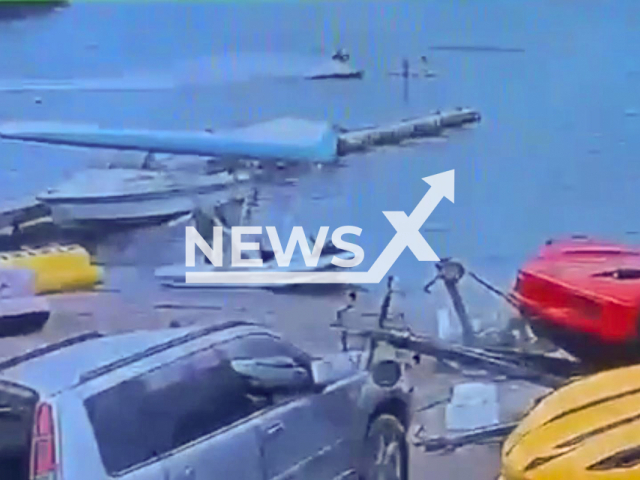 This image is a screen grab of the video supplied titled NewsX-SkiPaddleBoard-01.mp4: Footage shows a drunk man on a jet ski hit two girls on a paddleboarders ii Primorsky Krai, Russia on Monday. Aug 4, 2025.(Clipzilla/NX)