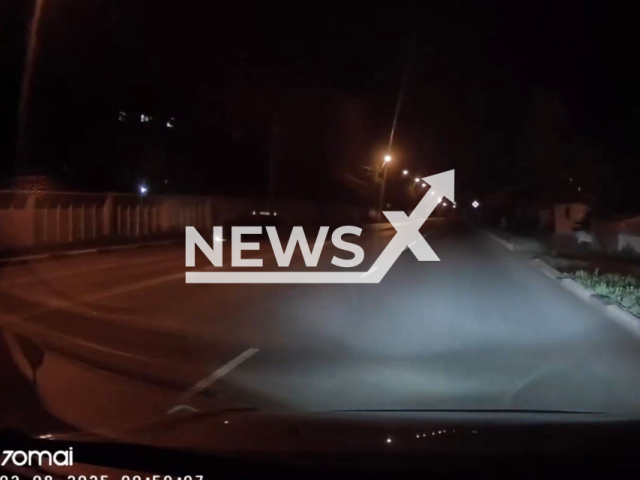 This image is a screen grab of the video supplied titled NewsX-NightFlip-01.mp4: Video shows car flipping over onto its roof after overtaking another vehicle on the road in Omsk, Russia on Sunday, Aug 3,2025.(Clipzilla/NX)