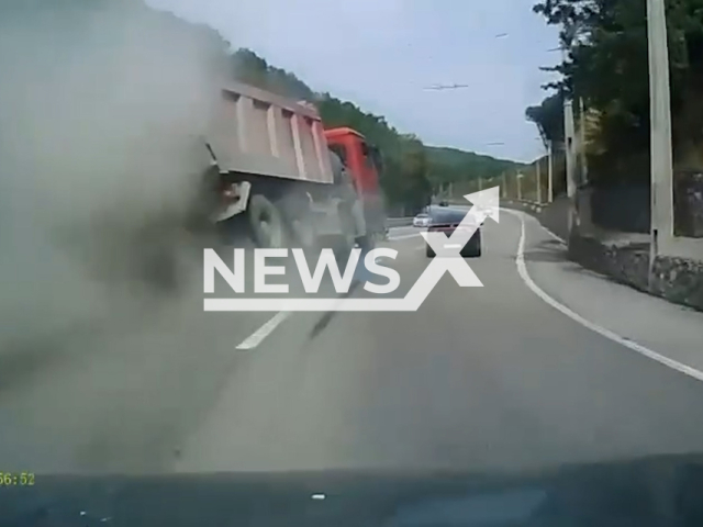 This image is a screen grab of the video supplied titled NewsX-TireTurn-01.mp4: Footage shows a truck's tires exploding at high speed and narrowly escaping coalitions with vehicle on the Alushta-Simferopol highway, Crimea, Ukraine on Saturday, Aug 2, 2025.(Clipzilla/NX)