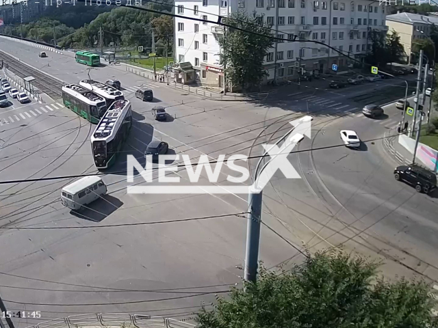 This image is a screen grab of the video supplied titled NewsX-TramDirection-01.mp4: CCTV shows two trams colliding at at the intersection of Pobedy Avenue and Rossiyskaya Street in Chelyabinsk, Russia on Tuesday, Aug 5, 2025.(Clipzilla/NX)