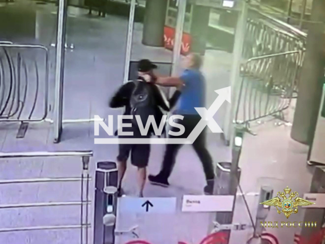 This image is a screen grab of the video supplied titled NewsX-TruckHuse-01.mp4: CCTV footage shows security guard restraines man despite being stabbed in neck and arm at the Moscow metro station "CSKA", Russia on Tuesday, Aug 5, 2025.(Clipzilla/NX)