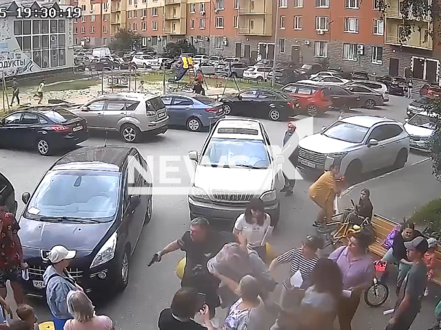 This image is a screen grab of the video supplied titled NewsX-BabushkasFight-01.mp4: CCTV shows man using gun to threaten housing management company over hot water and is beaten by other women in Tyumen, Russia on Tuesday, Aug 5, 2025.( Clipzilla/NX)