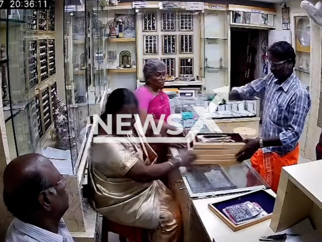This image is a screen grab of the video supplied titled NewsX-AcidRob-01.mp4: CCTV shows robbers throwing acid at jewellery staff in Attur, Salem, India on Thursday, Aug 7, 2025.(Clipzilla/NX)