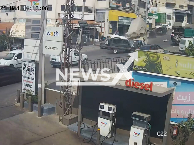 This image is a screen grab of the video supplied titled NewsX-NoControl-01.mp4: CCTV shows a truck violently colliding with army vehicles on a main road in Bechamoun, Lebanon on Wednesday, Aug 6, 2025.(Clipzilla/NX)